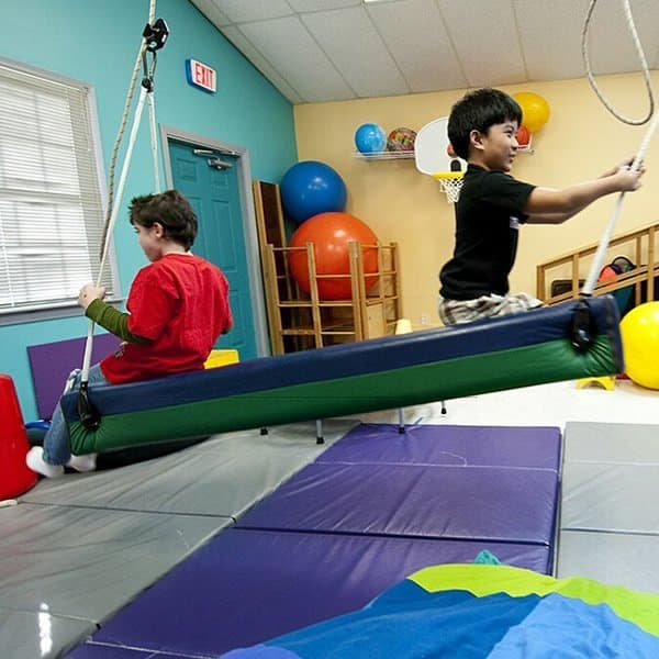 Child developing motor skills through early intervention therapy at KidStart